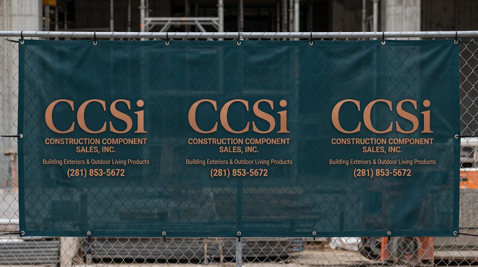 Three repeating custom mesh fence banners spanning a construction perimeter fence